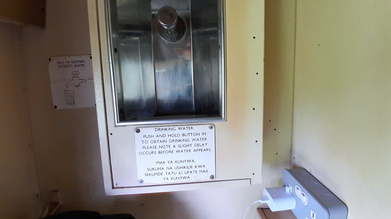 It was a steal during peak season at a thousand bob in first-class. Even if the charging ports were comatose, the water dispenser thirsted for a mechanic's touch and the sliding window danced a stubborn tango with its frame.