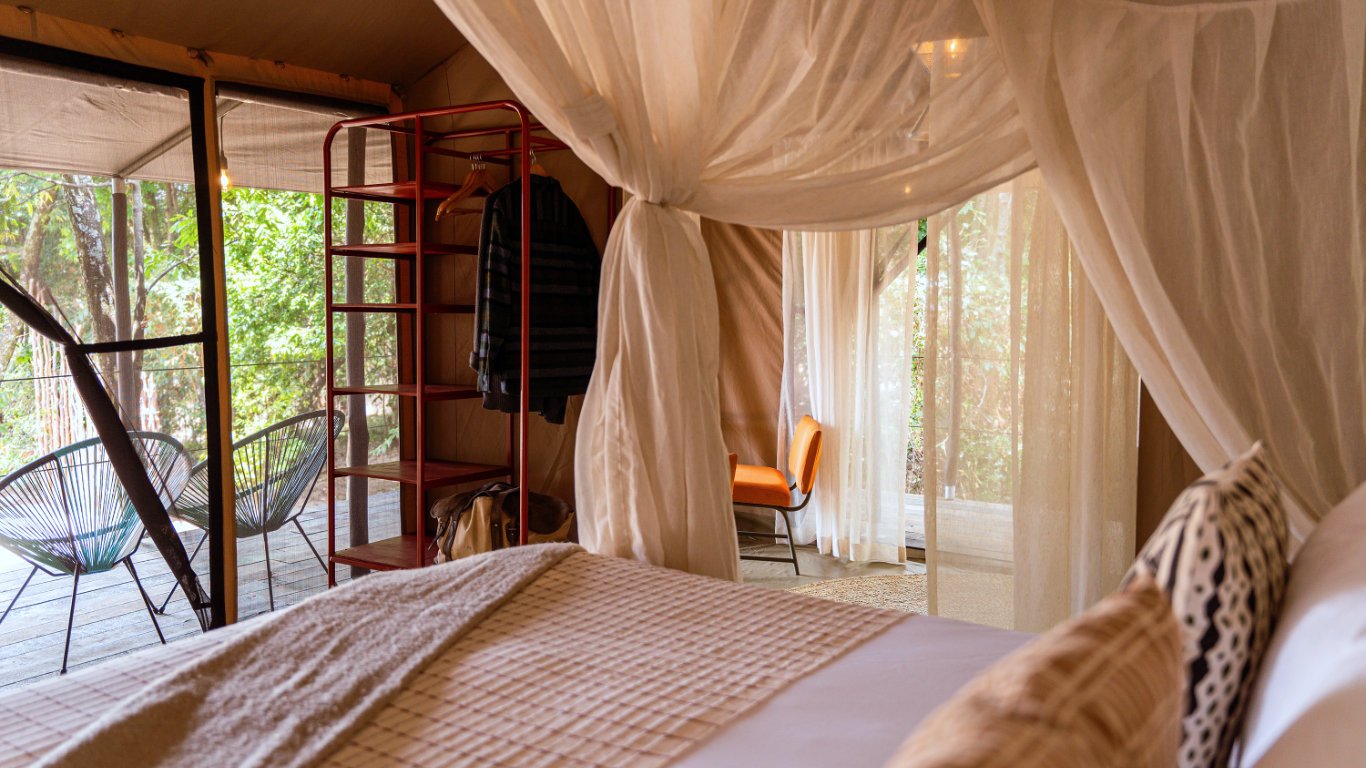 At Emboo River Camp, "Emboo" symbolizes a pride of lions in Maasai culture, reflecting the camp's deep connection to nature and community. This camp is the first carbon-neutral destination in the Maasai Mara, encouraging visitors to experience a more harmonious relationship with wildlife.